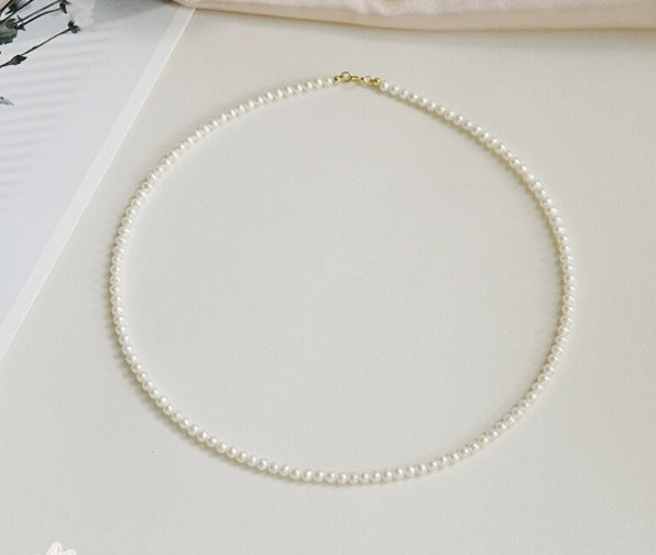 Very fine 2-3mm nearly round freshwater pearl necklace