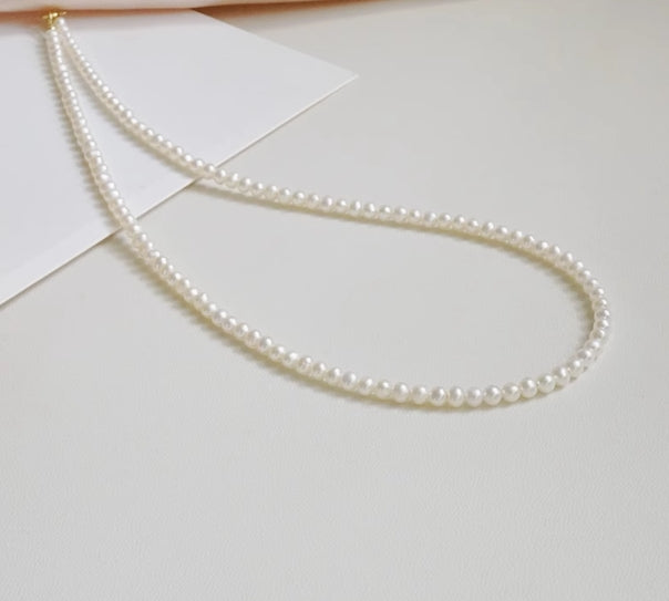 Very fine 2-3mm nearly round freshwater pearl necklace