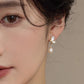 White butterfly shell niche earrings